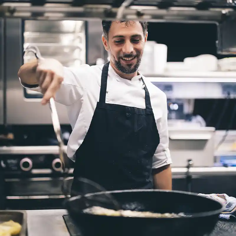 Chef Cooking in Kitchen