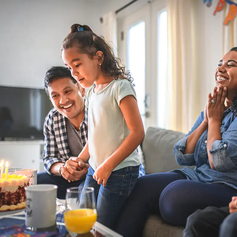 image of family celebrating child's birthday